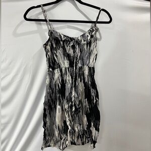 Black, white, gray patterned dress with ruffle detail and elastic waist